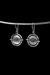 Old World Labradorite Circle single earring in hammered 925 sterling silver shown worn on the ear.