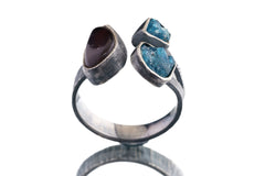 Apatite and Ammolite Ammonite ring on a white background, showing textured sterling silver band and open-back construction.