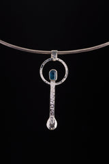 Blue Apatite spoon pendant displayed on a choker, showing wearable talisman styling and silver spoon form.