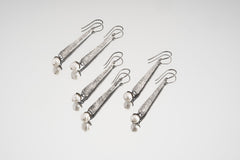 Collection of handmade Pearl gumnut earrings shown on white background with textured sterling silver settings.