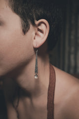 Rustic Pearl statement earring shown worn on a model, with layered sterling silver and ocean-born Pearl detail.
