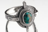 Himalayan Turquoise Compass Ring shown on white background with textured sterling silver and blue-green Turquoise centre.