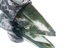 Close-up of Nepal Inclusion Quartz showing green mineral inclusions, natural crystal structure, and oxidized sterling silver setting.