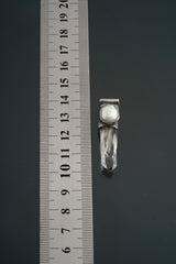 Nepal Inclusion Quartz Stack Pendant shown beside a ruler for scale with old South Sea Pearl and oxidized silver cap.