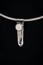Nepal Inclusion Quartz South Sea Pearl Stack Pendant shown on black background with oxidized sterling silver cap and clear crystal body.