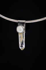 Nepal Inclusion Quartz South Sea Pearl Stack Pendant shown on black background with oxidized sterling silver cap and clear crystal body.