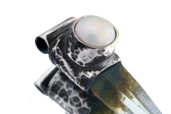 Close-up of old South Sea Pearl set above Nepal Inclusion Quartz in an oxidized sterling silver Stack Pendant cap.