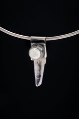Nepal Clear Quartz and South Sea Pearl Stack Pendant shown on black background with silver choker and clear crystal body.