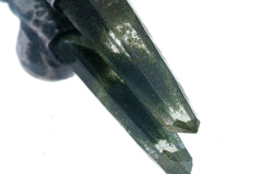 Close-up of Nepal Inclusion Quartz showing green internal mineral character and oxidized sterling silver setting.