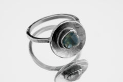 Raw Sapphire Silver Dome Ring shown on white background with textured silver dome and natural gemstone centre.