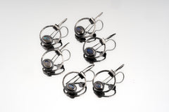 Labradorite Cat Eye earrings displayed as a matching pair with rustic sterling silver and mystical eye-shaped design.