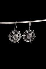 Labradorite earrings displayed on a dark background, showing circle cross construction and polished sterling silver finish.