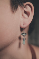 Labradorite Aquamarine earrings shown worn on a model, with sterling silver hooks and layered gemstone dangle design.