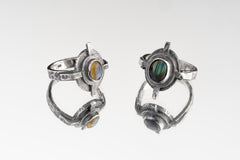Group of Rainbow Labradorite Compass Rings shown on white background with oxidized sterling silver and gemstone flash.