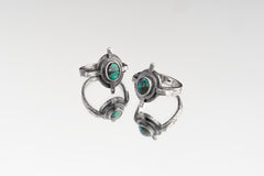 Group of Himalayan Turquoise Compass Rings shown on white background with old-world sterling silver settings.