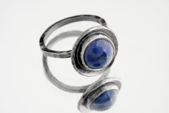 Brazilian Lapis Lazuli sterling silver dome ring shown on a light background, with textured silver and deep blue stone.