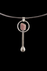 Rhodochrosite spoon pendant shown on a silver choker with hammered 925 sterling silver and pink gemstone setting.
