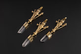 Lord Shiva Clear Quartz talisman pendant shown on a dark background with hammered brass figure and Himalayan Quartz crystal.