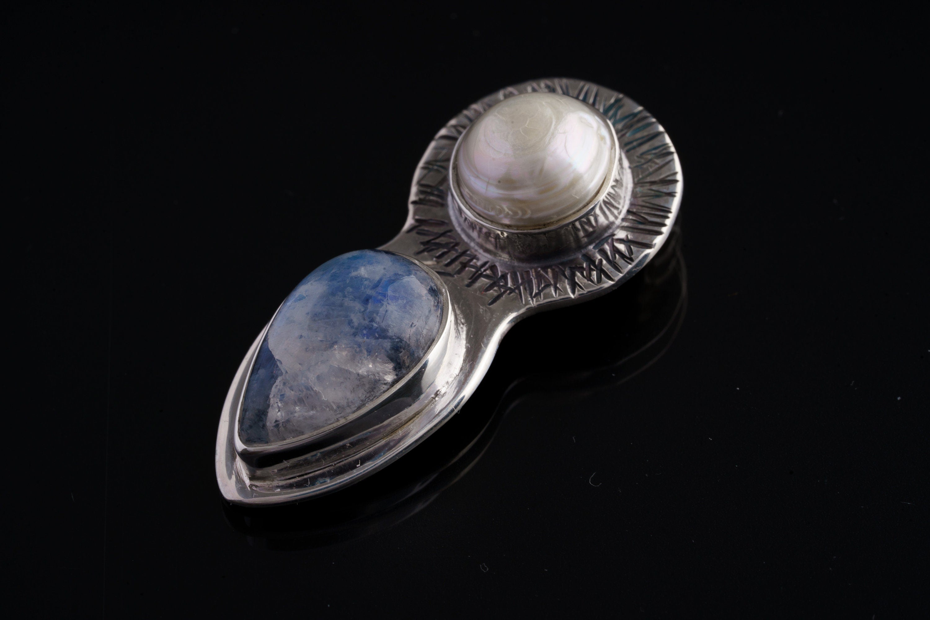 Blue Moonstone Pearl Venus pendant shown on dark background with handmade sterling silver goddess design.
