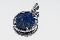 Close-up of deep blue Brazilian Lapis Lazuli with golden Pyrite inclusions in an oxidized sterling silver oval frame.
