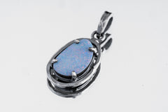 Lightning Ridge Opal Doublet pendant in oxidized 925 sterling silver, showing organic oval frame and four-prong setting.