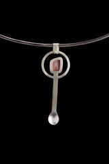 Rhodochrosite hammered spoon pendant displayed on a choker, showing wearable talisman styling and silver spoon shape.