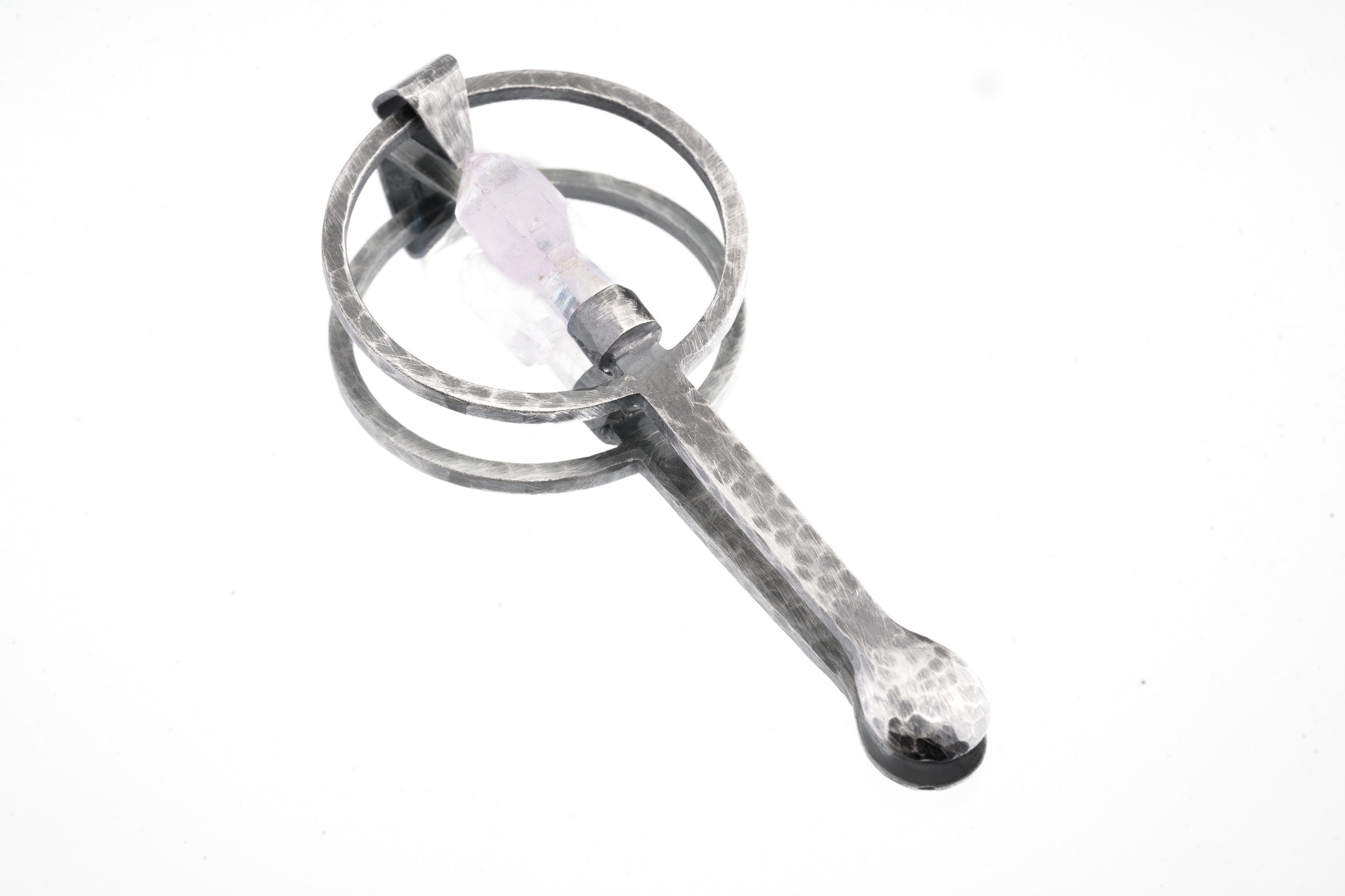 Raw Aquamarine sterling silver spoon pendant shown on white background with oxidized hammered silver and pale blue stone.