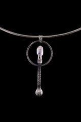 Raw Aquamarine spoon pendant shown on a silver choker with oxidized 925 sterling silver and blue-green stone setting.