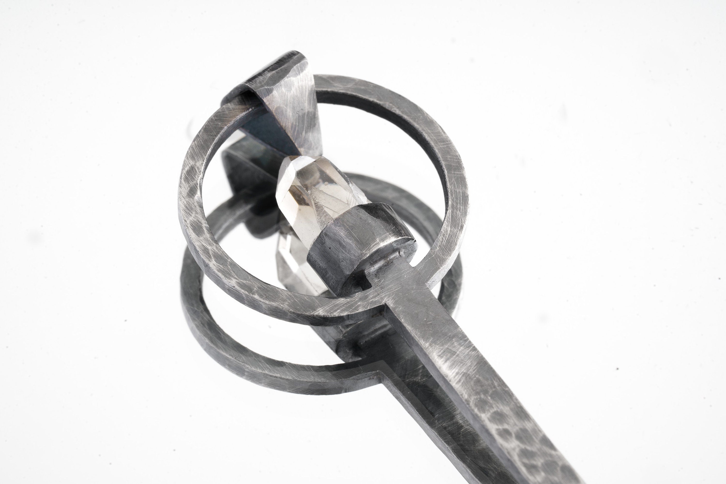 Close-up of raw Aquamarine ritual spoon showing hammered oxidized silver texture and pale blue-green crystal.