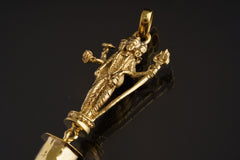 Lord Shiva Clear Quartz pendant shown on a dark background with warm brass setting and clear crystal point.