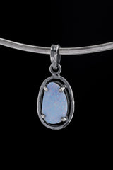 Single Lightning Ridge Opal Doublet pendant on black background with oxidized sterling silver frame and 7 mm bail.