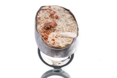 Front view of Garnet Calcite matrix ring in polished sterling silver, showing raw mineral texture and earthy red crystal detail.