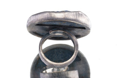 Back view of XXL Lapis Lazuli statement ring showing thick sterling silver setting and large round blue stone.