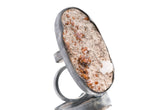Garnet and Calcite matrix adjustable ring in shiny 925 sterling silver with thick waved bezel and textured open band.
