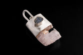 Pink Kunzite Sapphire wand pendant shown on a dark background with brushed 925 sterling silver cap and large hinged bail.
