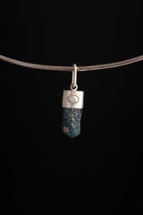Blue Apatite Pearl pendant shown worn on a black necklace, with raw terminated crystal and brushed silver cap setting.