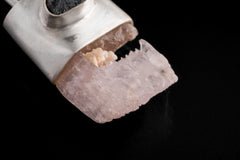 Close-up of raw Pink Kunzite crystal in brushed sterling silver cap with small Australian Sapphire accent.