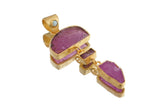 Gold-plated multi-stone pendant with Lightning Ridge Black Opal, Brazilian Rubellite, raw Pink Tourmaline, and Ruby on a white background.