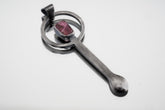 Pink Tourmaline sterling silver brushed spoon pendant shown on white background with soft pink stone and sculptural silver form.
