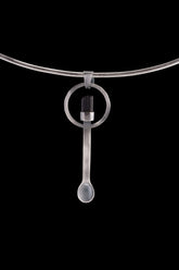 Black Tourmaline spoon pendant shown on a silver choker with solid 925 sterling silver and dark crystal detail.