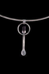 Black Tourmaline spoon pendant shown on a silver choker with solid 925 sterling silver and dark crystal detail.