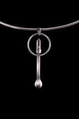 Clear Quartz Generator silver spoon pendant displayed on a choker, showing wearable talisman styling and spoon form.