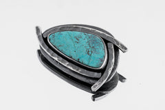 Australian Chrysocolla Sun Triangle Pendant shown on white background with vivid blue-green stone and oxidized silver frame.