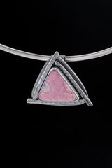 Rhodochrosite triangle pendant displayed on a choker with concealed tube bail and oxidized silver setting.