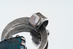 Close-up of Chrysocolla accent set into the bail of oxidized sterling silver Moonstone pendant.