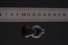 Gem Amethyst Black Rutile Quartz pendant shown beside ruler for approximate size reference.