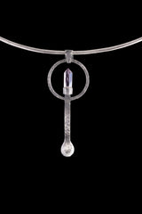 Amethyst Generator silver ritual spoon displayed on a choker, showing wearable talisman styling and spoon form.