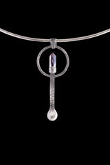 Amethyst Generator silver ritual spoon displayed on a choker, showing wearable talisman styling and spoon form.