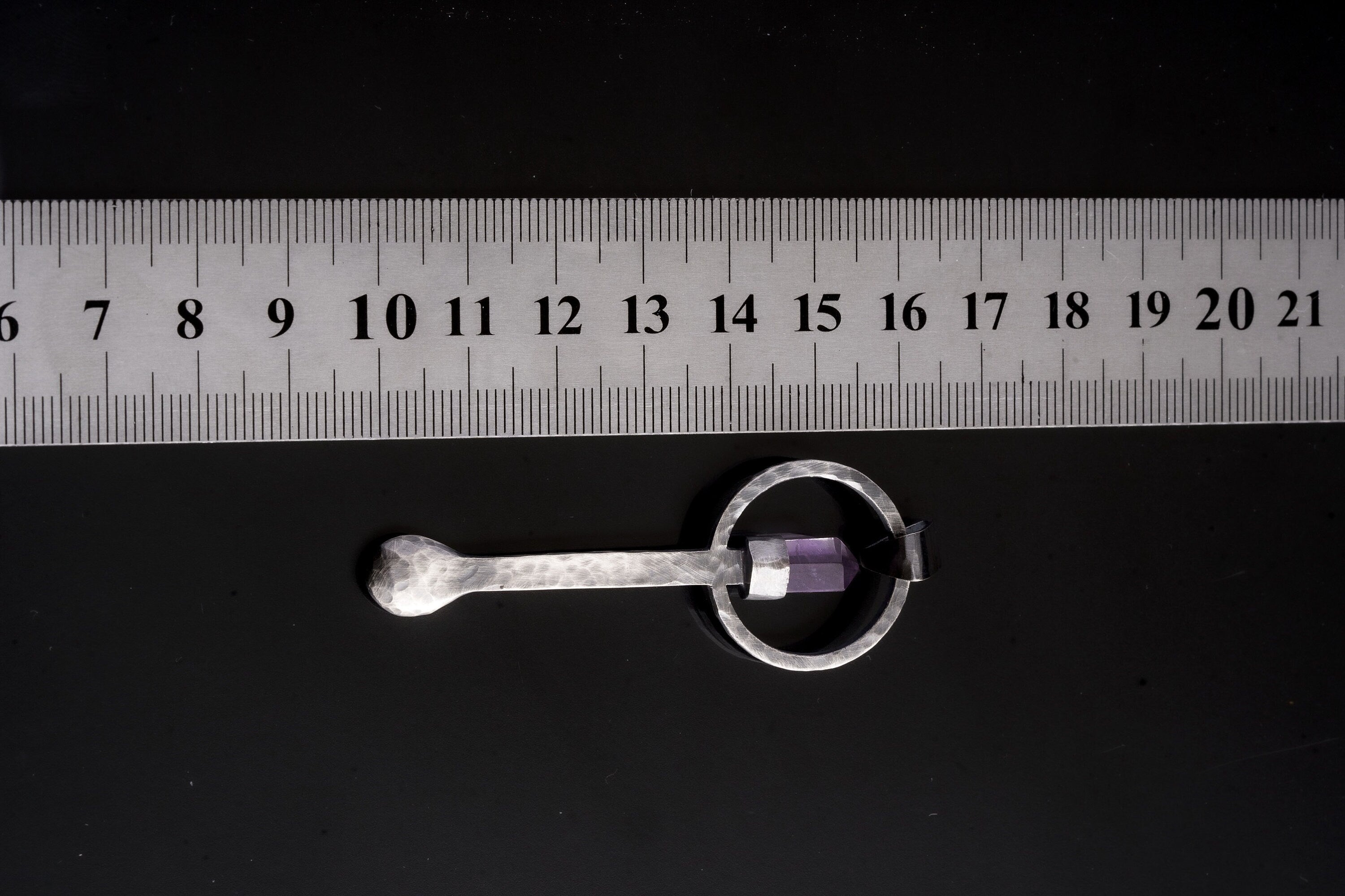 Amethyst Generator sterling silver ritual spoon shown beside a ruler for scale with solid cast silver body.