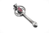 Rubellite Tourmaline sterling silver brushed spoon pendant shown on white background with red-pink stone and sculptural silver form.